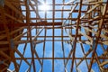 New construction home framing against blue sky, closeup of ceiling frame. Royalty Free Stock Photo