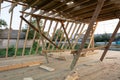 New construction home framing against blue sky at sunset Royalty Free Stock Photo