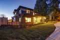 New construction home with low slope roof and brown siding. Royalty Free Stock Photo