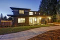 New construction home with low slope roof and brown siding. Royalty Free Stock Photo