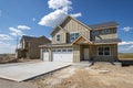 A new construction home still under construction, with a 3 car garage goes up in a Spokane, Washington Royalty Free Stock Photo