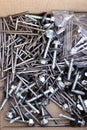 New construction nails and screws in a paper box Royalty Free Stock Photo