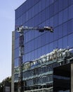 New construction reflected on a glass facade Royalty Free Stock Photo