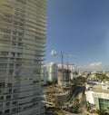 New construction site of developing residense in american urban area. Industrial tower lifting cranes in Miami, Florida Royalty Free Stock Photo