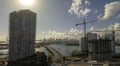 New construction site of developing residense in american urban area. Industrial tower lifting cranes in Miami, Florida