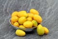New crop, fresh kumquats in the metal bowl Royalty Free Stock Photo