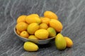 New crop, fresh kumquats in the metal bowl