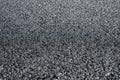 A new dark grey asphalt road texture. Royalty Free Stock Photo