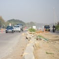 New Delhi, India - April 16, 2023 - View of Vehicles passing through the main road near Indra Gandhi International Airport Delhi