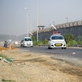 New Delhi, India - April 16, 2023 - View of Vehicles passing through the main road near Indra Gandhi International Airport Delhi