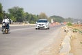 New Delhi, India - April 16, 2023 - View of Vehicles passing through the main road near Indra Gandhi International Airport Delhi