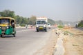 New Delhi, India - April 16, 2023 - View of Vehicles passing through the main road near Indra Gandhi International Airport Delhi