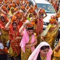 New Delhi, India April 03 2022 - Women with Kalash on head during Jagannath Temple Mangal Kalash Yatra, Indian Hindu devotees Royalty Free Stock Photo