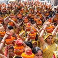 New Delhi, India April 03 2022 - Women with Kalash on head during Jagannath Temple Mangal Kalash Yatra, Indian Hindu devotees Royalty Free Stock Photo