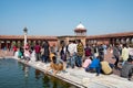 people evisitimng Jama Masjid in New Delhi, the most importand mosque in India Royalty Free Stock Photo