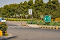 New Delhi, India, 2020. Green board NDMC street sign for Shanti Path in Chanakya Puri Embassy Area written in frour languages