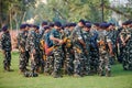 Indian police and military detachment await orders from higher authorities as military units