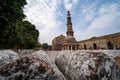 Tourists visit the Qutub Minar ancient pillar and ruins complex