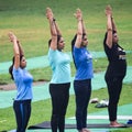 New Delhi, India, June 18 2022 - Group Yoga exercise class Surya Namaskar for people of different age in Lodhi Garden,