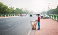 New Delhi, India - June 01 2019: A young child selling snacks near Rashtrapati Bhawan on the streets