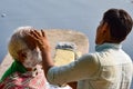 New Delhi, India - March 04, 2020: Handsome old man shaving his beard in bathroom during morning time at Yamuna river ghat in New Royalty Free Stock Photo