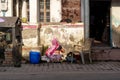 Unidentified Indian woman washing clothes outside her house Royalty Free Stock Photo
