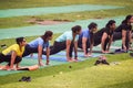 New Delhi, India, May 31 2023 - Group Yoga exercise class Surya Namaskar for people of different age in Lodhi Garden,