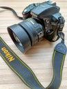 New Delhi, India, May 28 2023 - Nikon D5300 camera with 35mm f2.8 prime lens on plain background, Nikon DSLR camera shoot