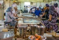 Volunteers preparing free food for visitors in the Gurdwara community kitchen Langar hall of Sri Bangla Sahib Gurudwara Sikh tem