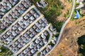 New development real estate. Aerial view of residential houses and driveways neighborhood during a fall sunset or sunrise time. Royalty Free Stock Photo