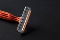 New disposable razor blade on a black background. Close-up of a razor blade. Skin care concept Royalty Free Stock Photo