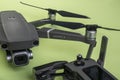 New DJI Mavic 2 PRO drone with Hasselblad camera and its controller on green background