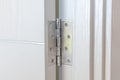 New door hinges Aluminum on white door Royalty Free Stock Photo