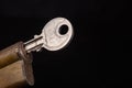 A new door lock on a dark background. A patent and keys to secure the front door Royalty Free Stock Photo