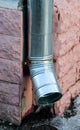 A new drainpipe on a corner of a building Royalty Free Stock Photo