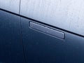 New electric car door handle electronic operated with water rain drops Royalty Free Stock Photo