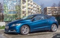 New elegant blue Honda CR-Z sports hybrid coupe parked