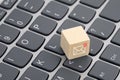 New email graphic on wooden block over laptop keyboard Royalty Free Stock Photo