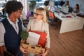 New employee.woman moving box with stuff at new office Royalty Free Stock Photo