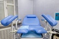New empty blue gynecological chair in a medical clinic Royalty Free Stock Photo