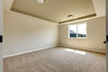 New empty room with beige carpet.