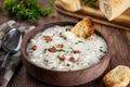 New England clam chowder with bacon, parsley and toasted bread Royalty Free Stock Photo