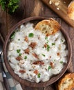 New England clam chowder with bacon, parsley and toasted bread Royalty Free Stock Photo