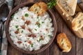 New England clam chowder with bacon, parsley and toasted bread Royalty Free Stock Photo