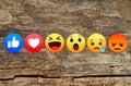 New Facebook like button 6 Empathetic Emoji Reactions on wooden background Royalty Free Stock Photo