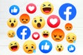 New Facebook like button 6 Empathetic Emoji Reactions on wooden background Royalty Free Stock Photo