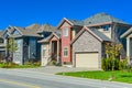 New family house with concrete driveway and asphalt road in front. Royalty Free Stock Photo