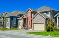 New family house with concrete driveway and asphalt road in front. Royalty Free Stock Photo