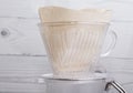New filter for subsequent alternative brewing of coffee in the funnel v60 close-up Royalty Free Stock Photo