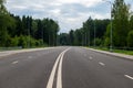 New four-lane highway with a forest background. Royalty Free Stock Photo